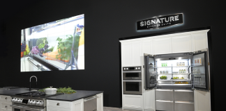 Signature Kitchen Suite built-in French Door refrigerator is displayed with other kitchen appliances in the LG booth at Kitchen and Bath Industry Show 2022