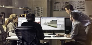 Chief construction engineer updating architects over video